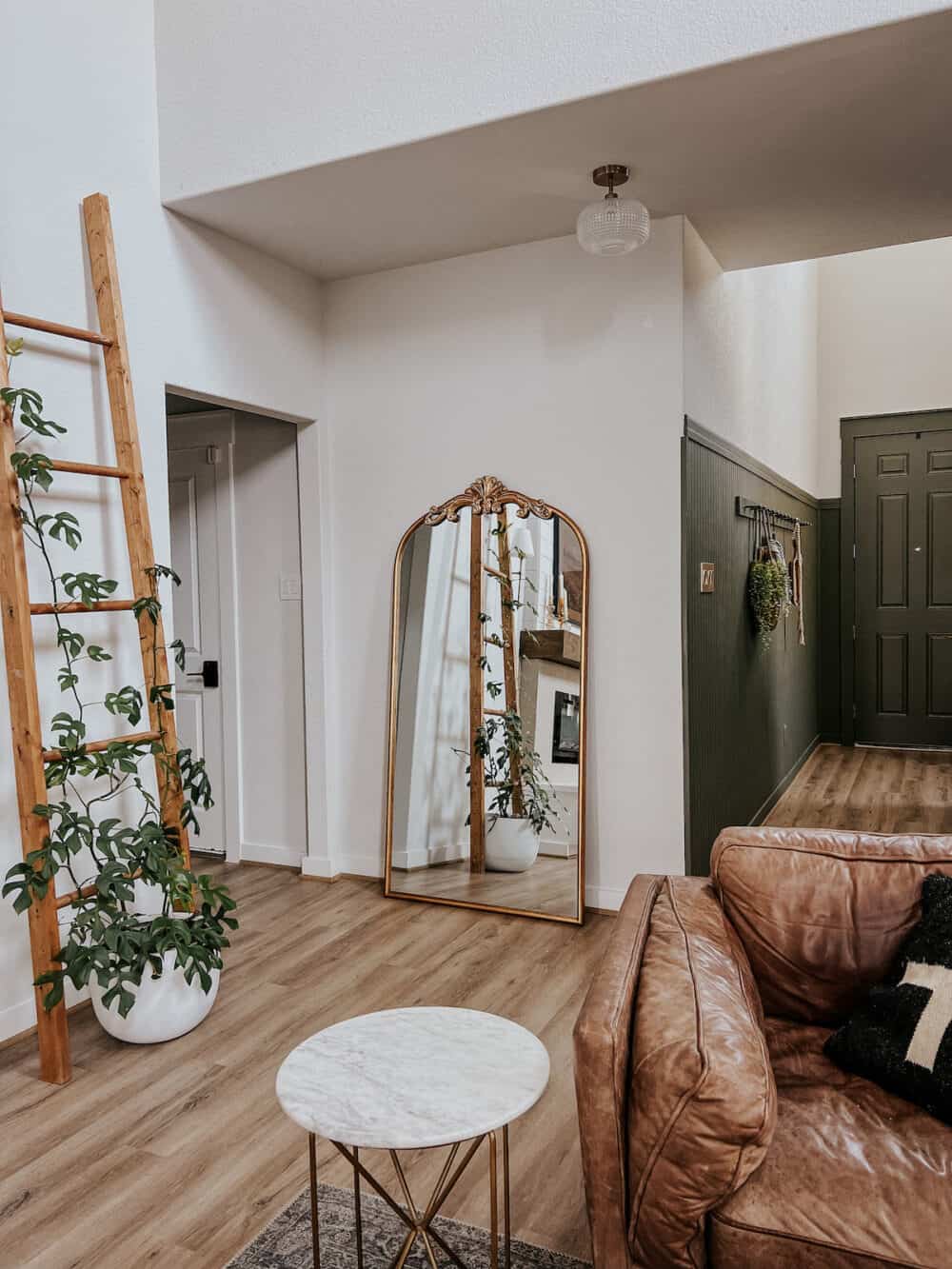 entry hallway with a beautiful brass semi-flush mount light