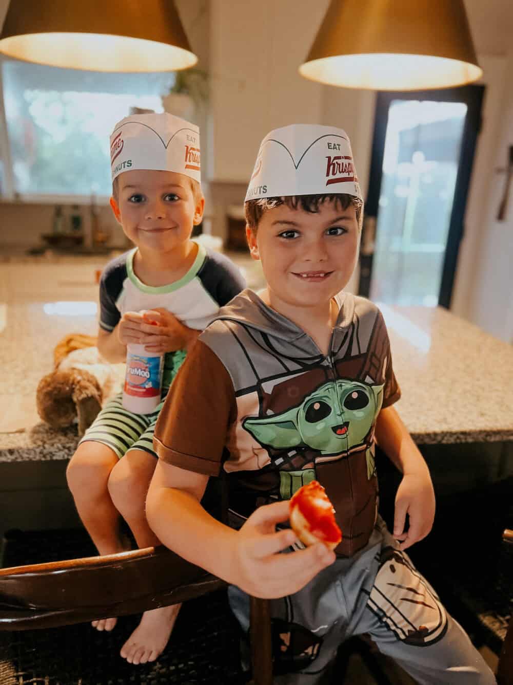 two boys smiling with donuts on a summer Yes Day
