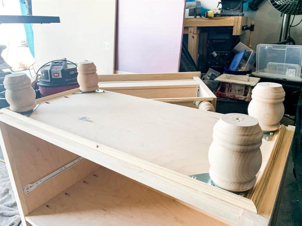 under-side of DIY nightstand with legs added 