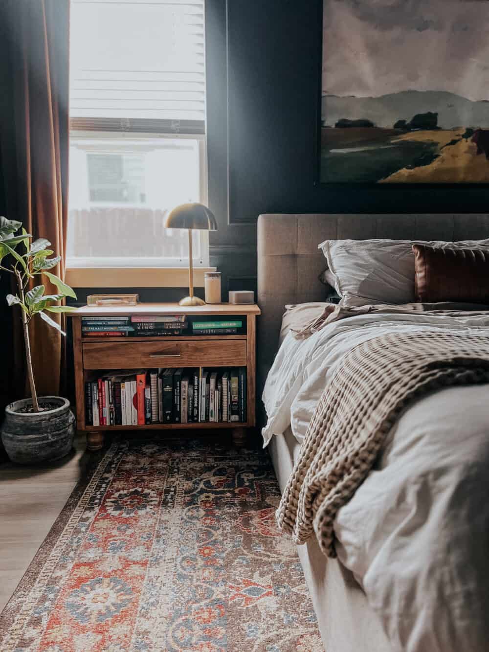 moody bedroom with a handmade nightstand