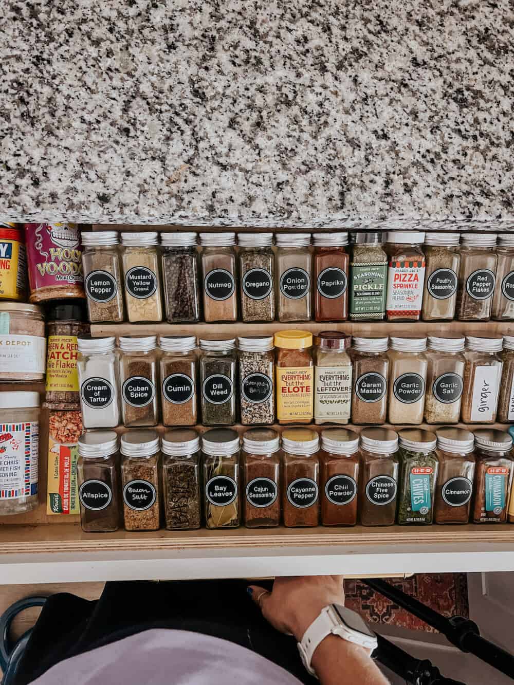 open spice drawer with all of the spices organized
