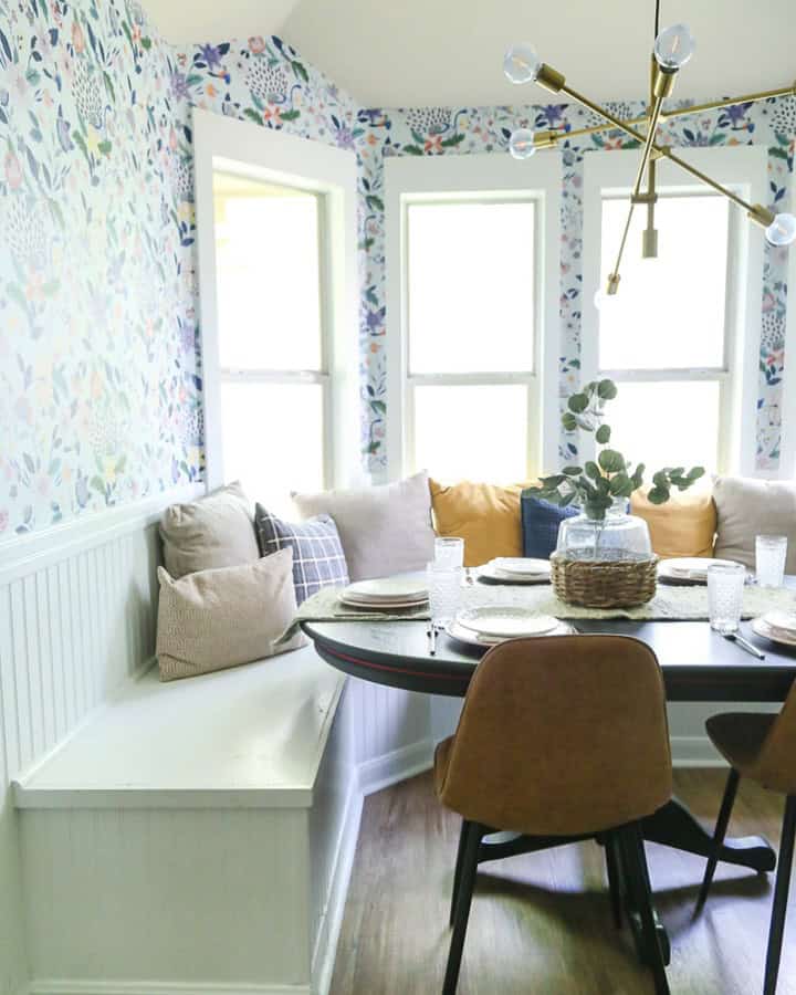 small cozy dining room with floral wallpaper