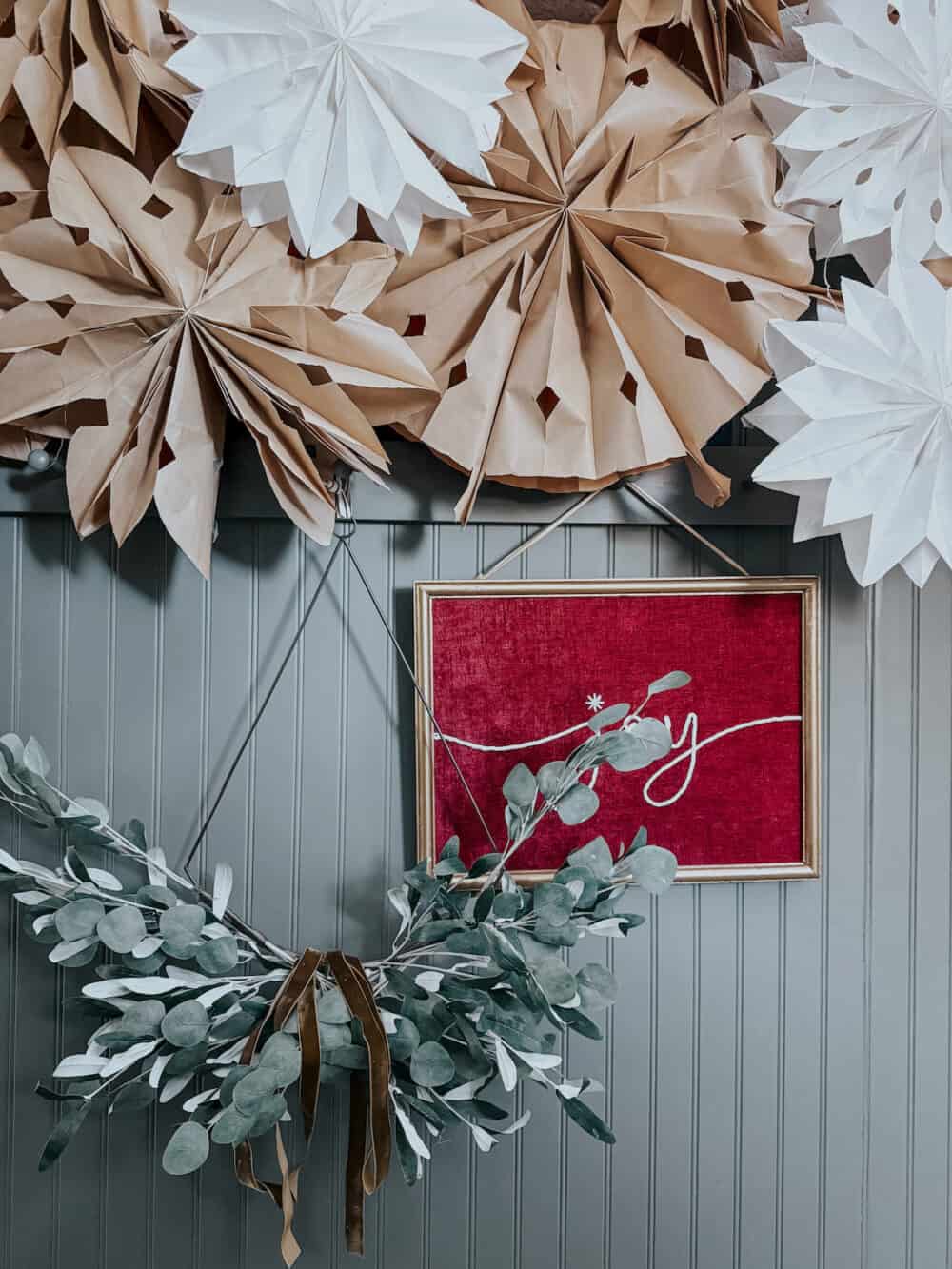 close up of peg rails decorated for Christmas
