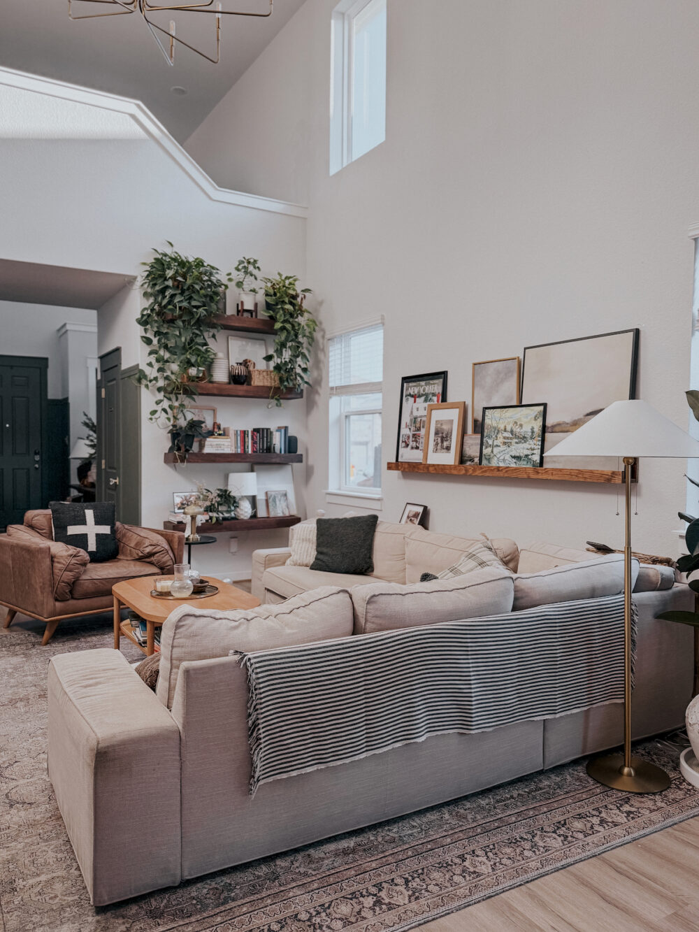 Living room with throw blanket styled over the back of the sofa
