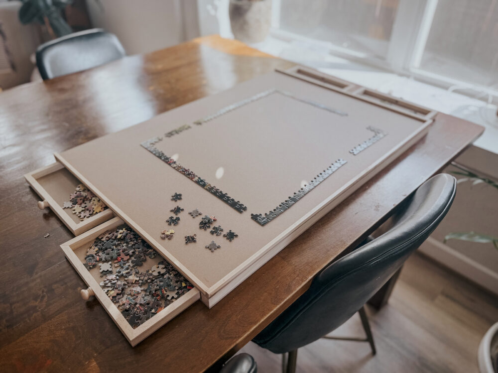 large puzzle board on a dining room table