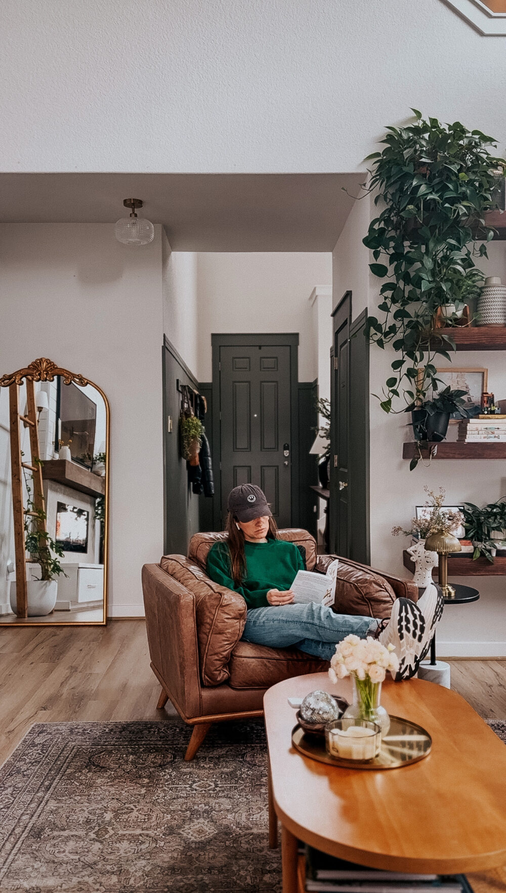 woman reading in a leather chair 