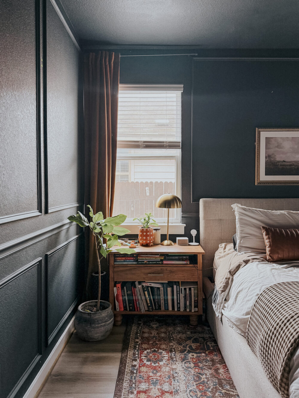 corner of a bedroom with Behr Ink Black on the walls