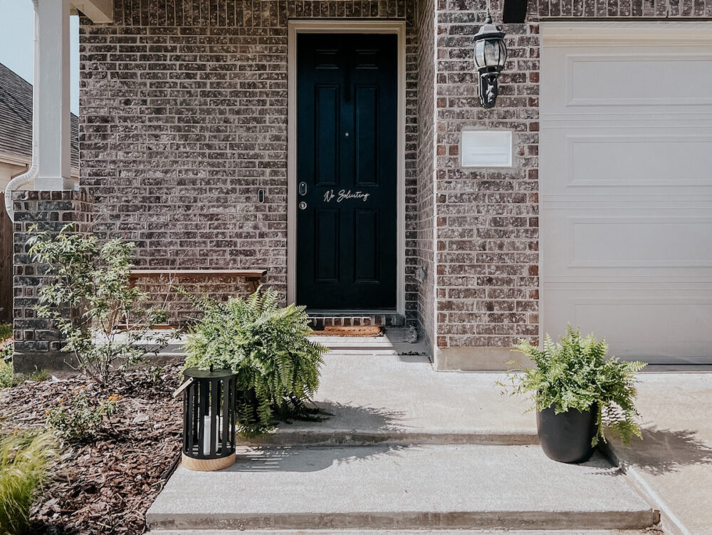 front entry with concrete front porch steps