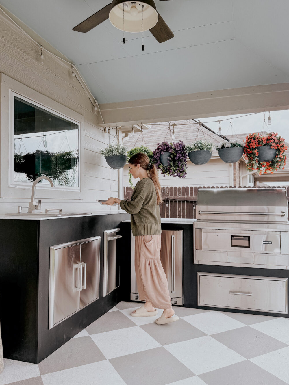 woman using an outdoor kitchen from RTA