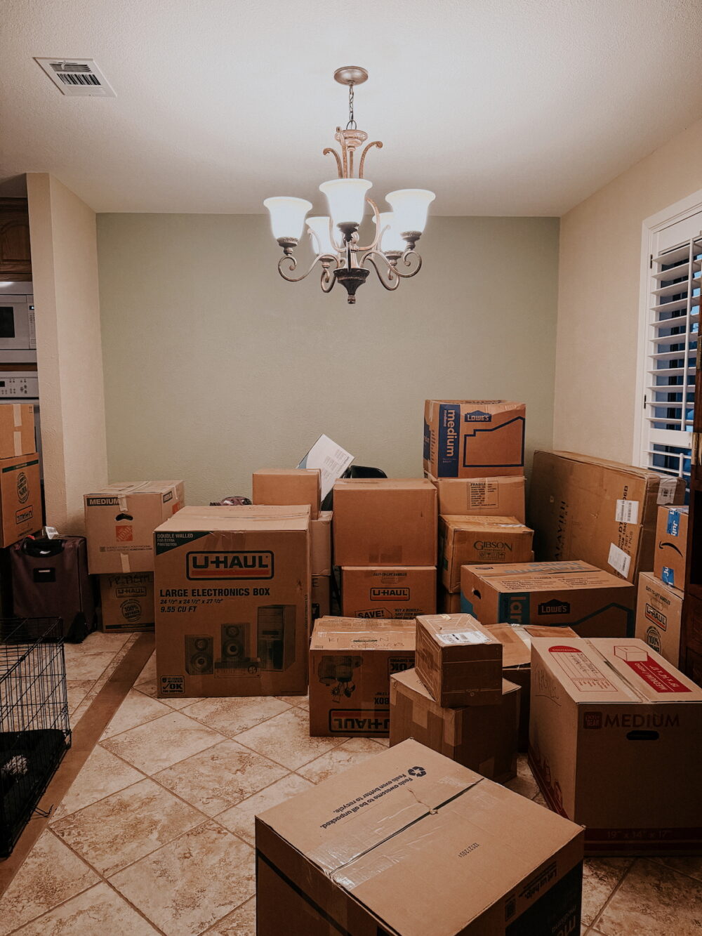 dining room full of moving boxes