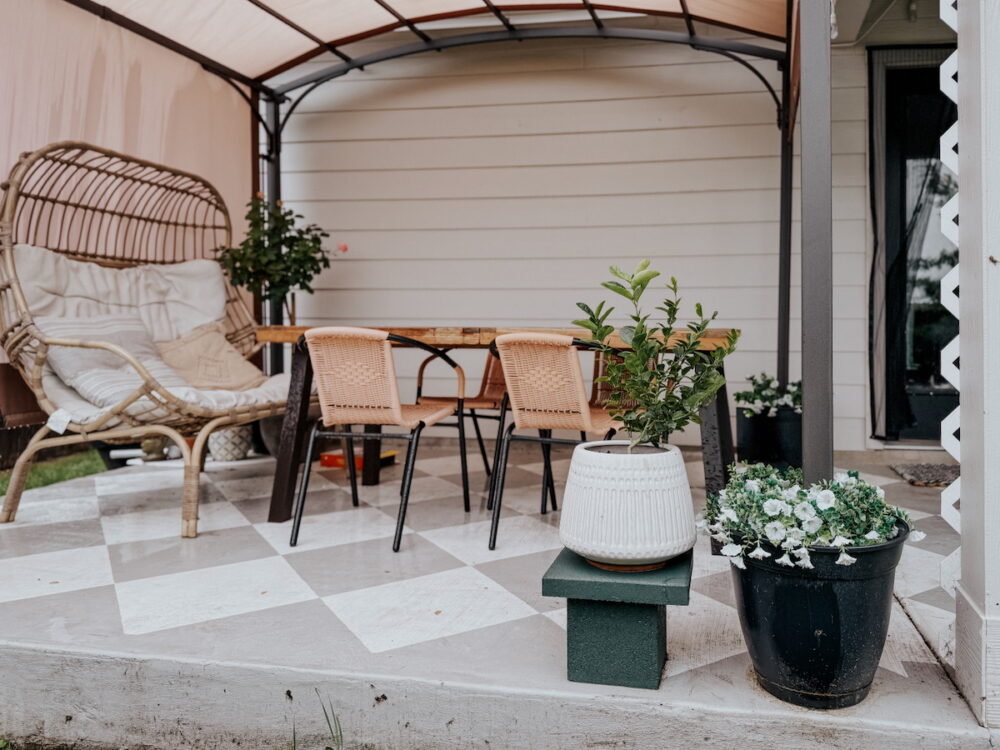 back patio with plants and a simple DIY plant stand