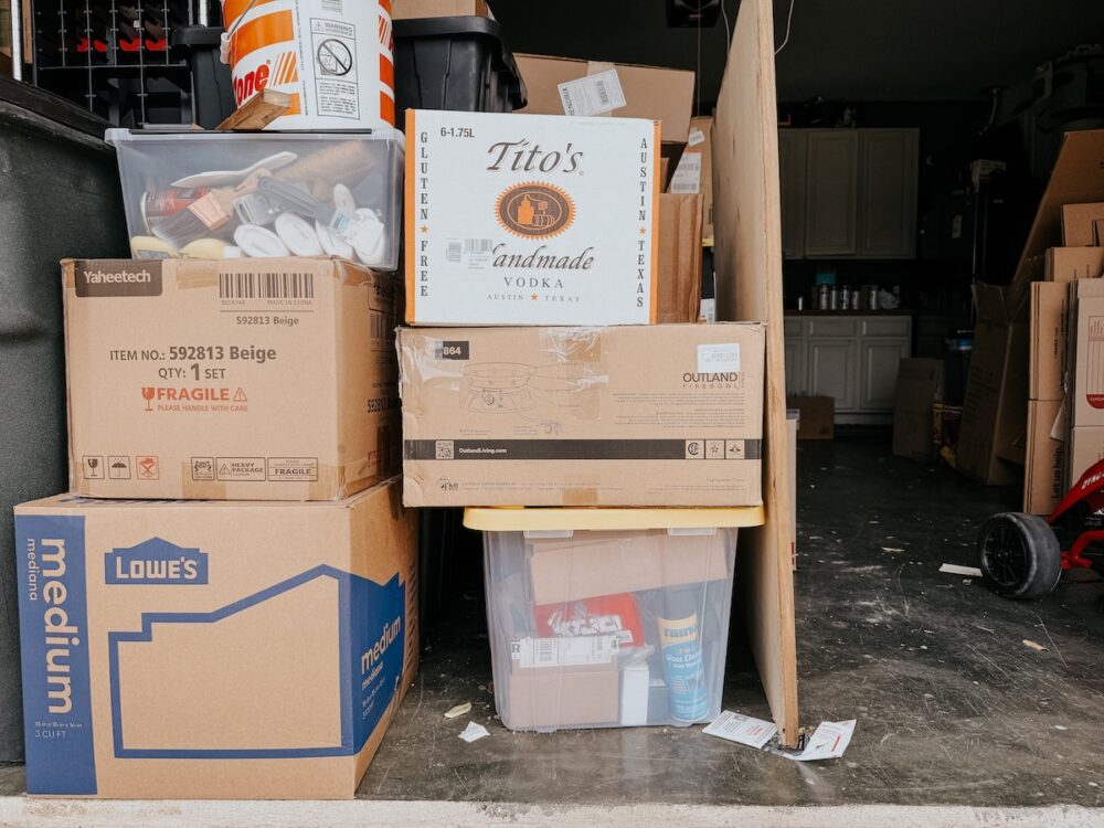 stack of moving boxes in a garage 