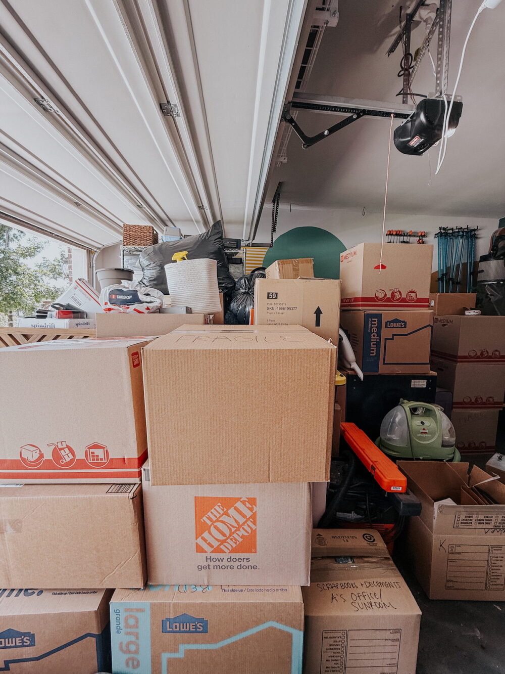 garage with moving boxes stacked up
