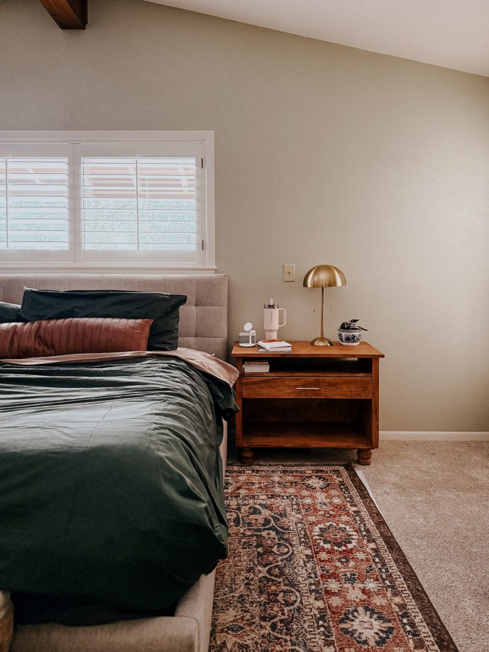 bedroom with green bedding 