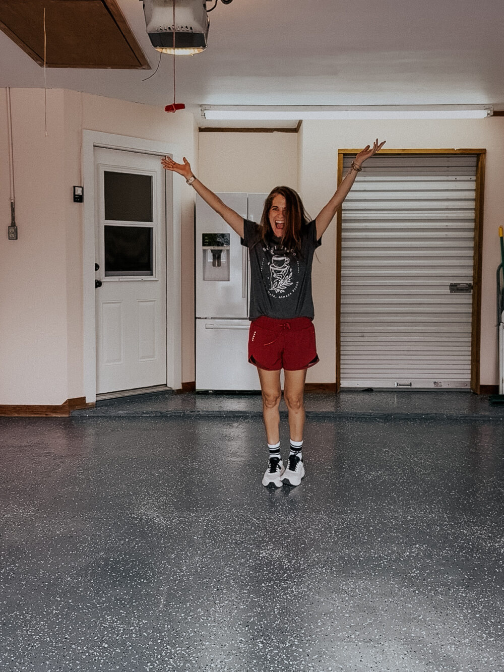 Woman celebrating a painted garage 