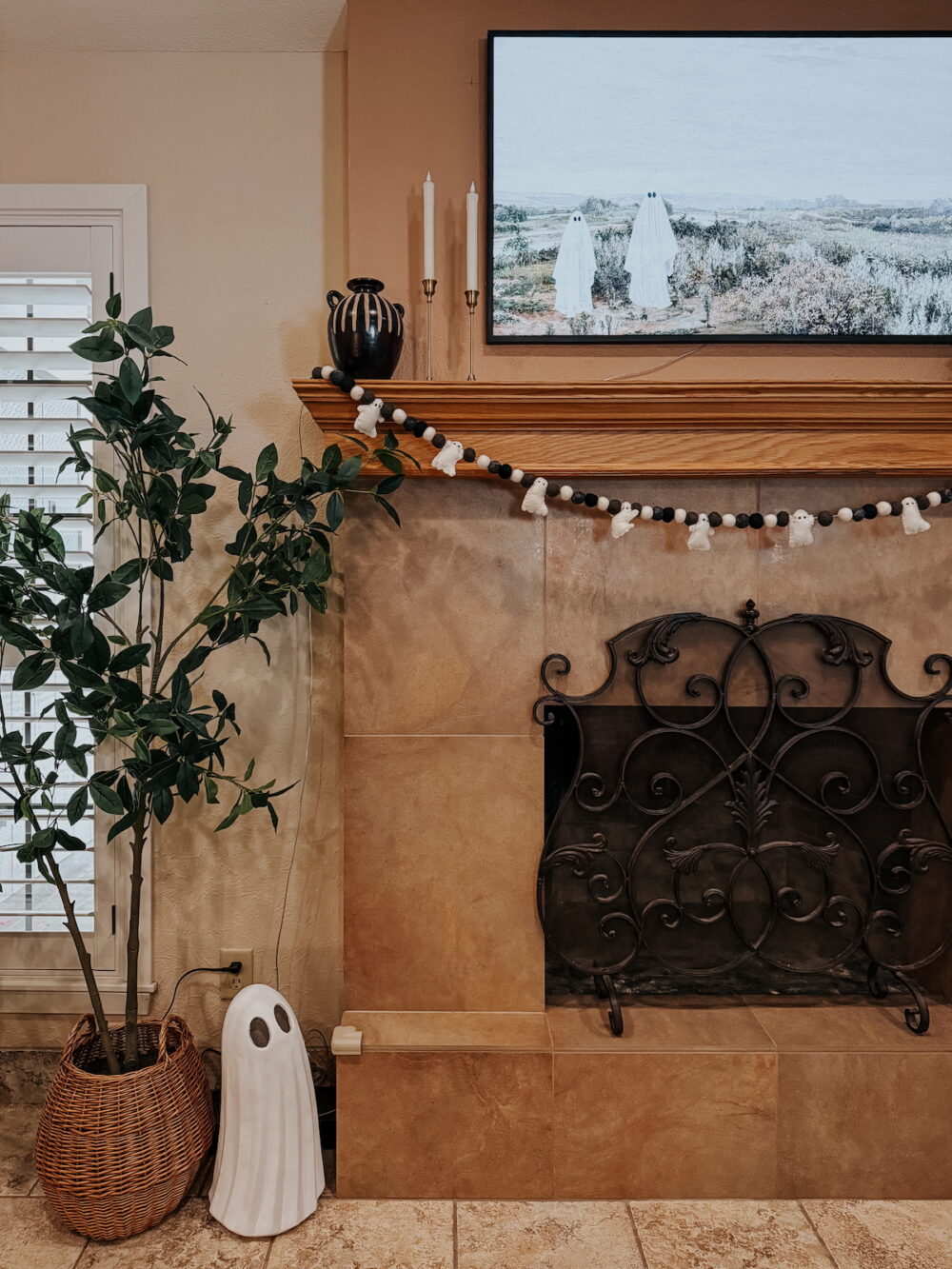 living room mantel decorated for Halloween