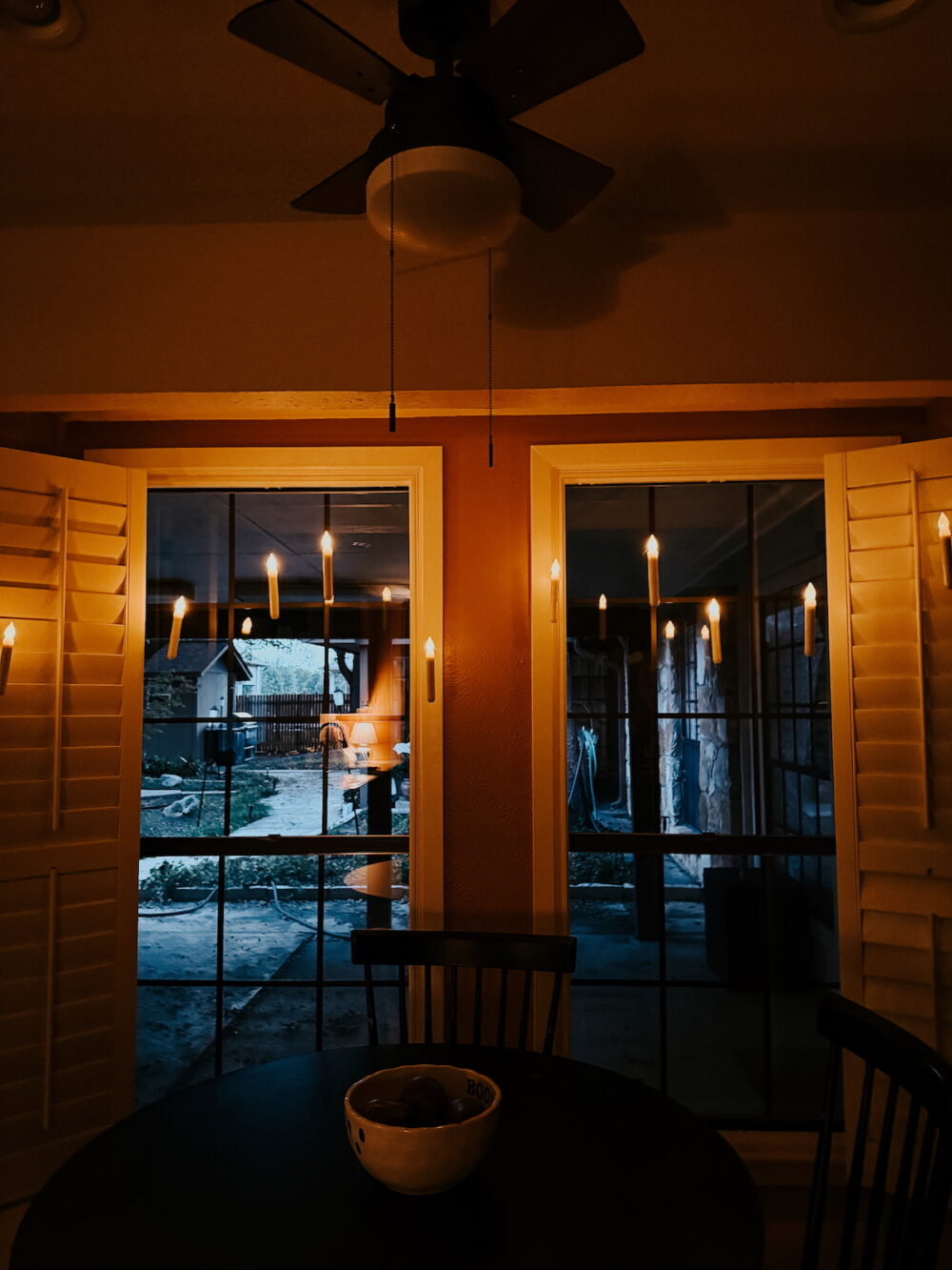 floating candles hung in a nook in a kitchen eating area