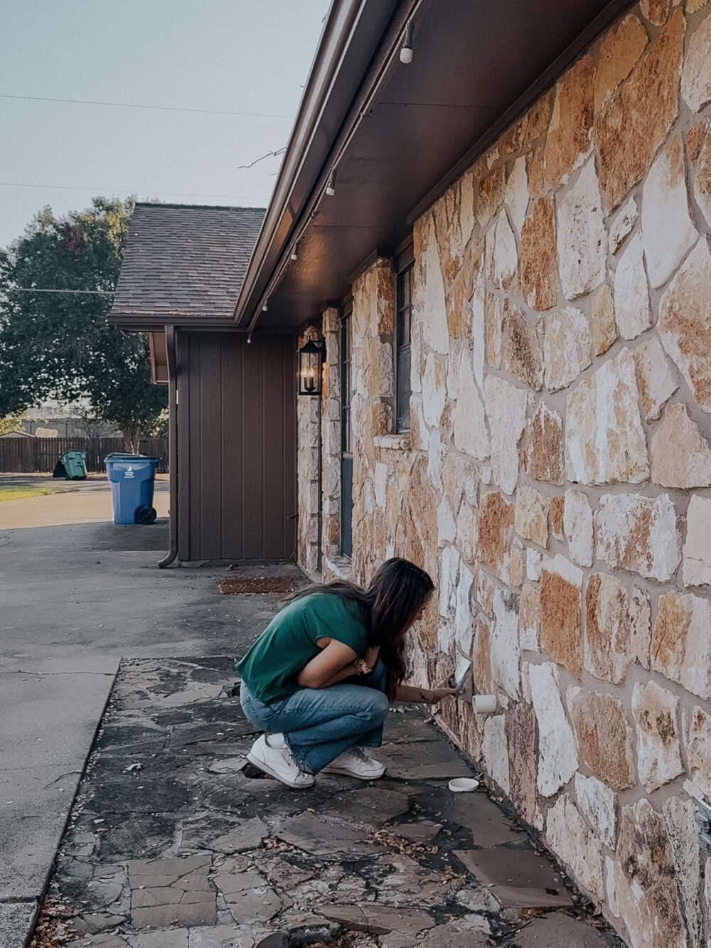 woman inspecting dryer vent 
