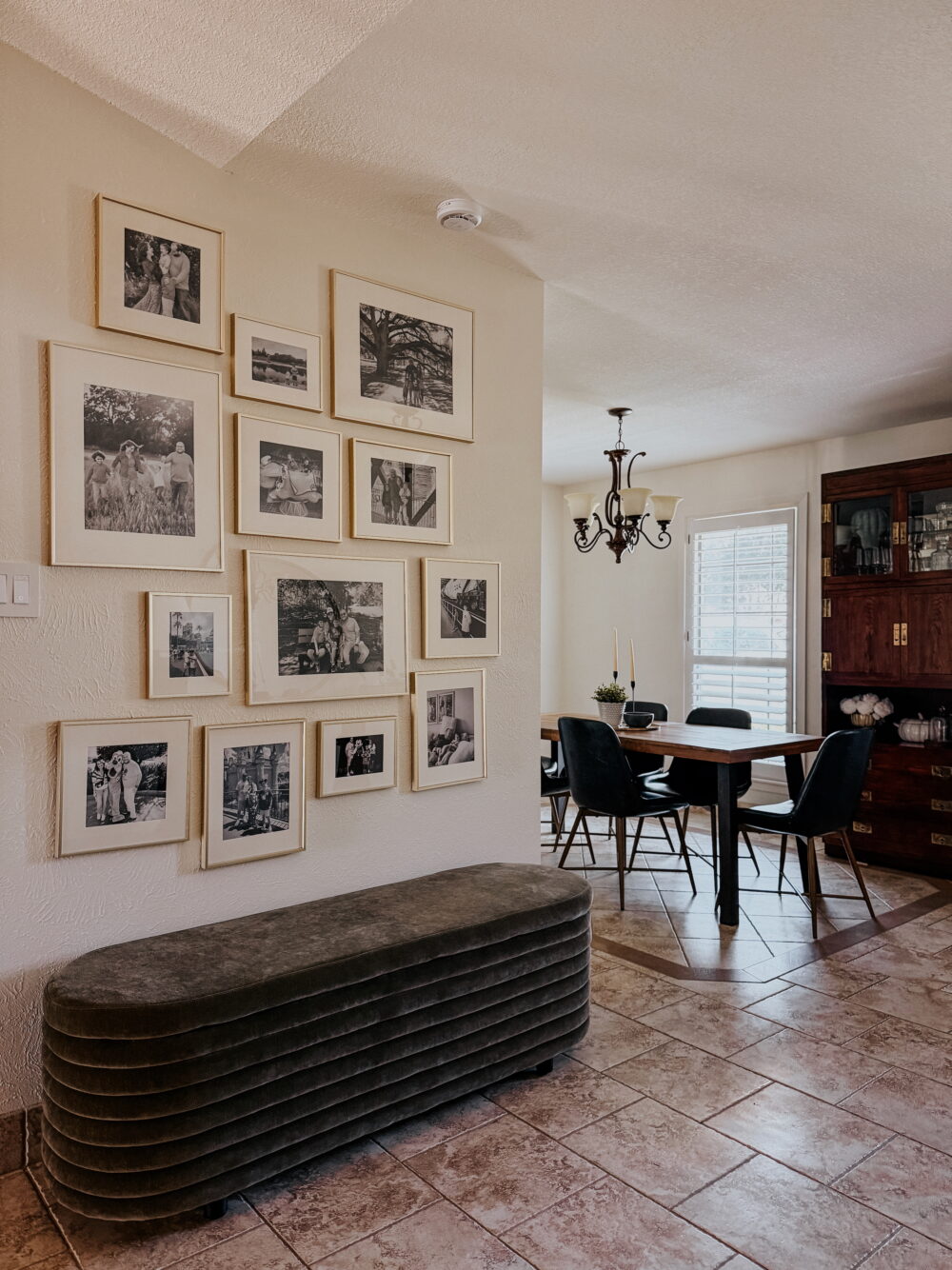 entry with gallery wall with gold frames
