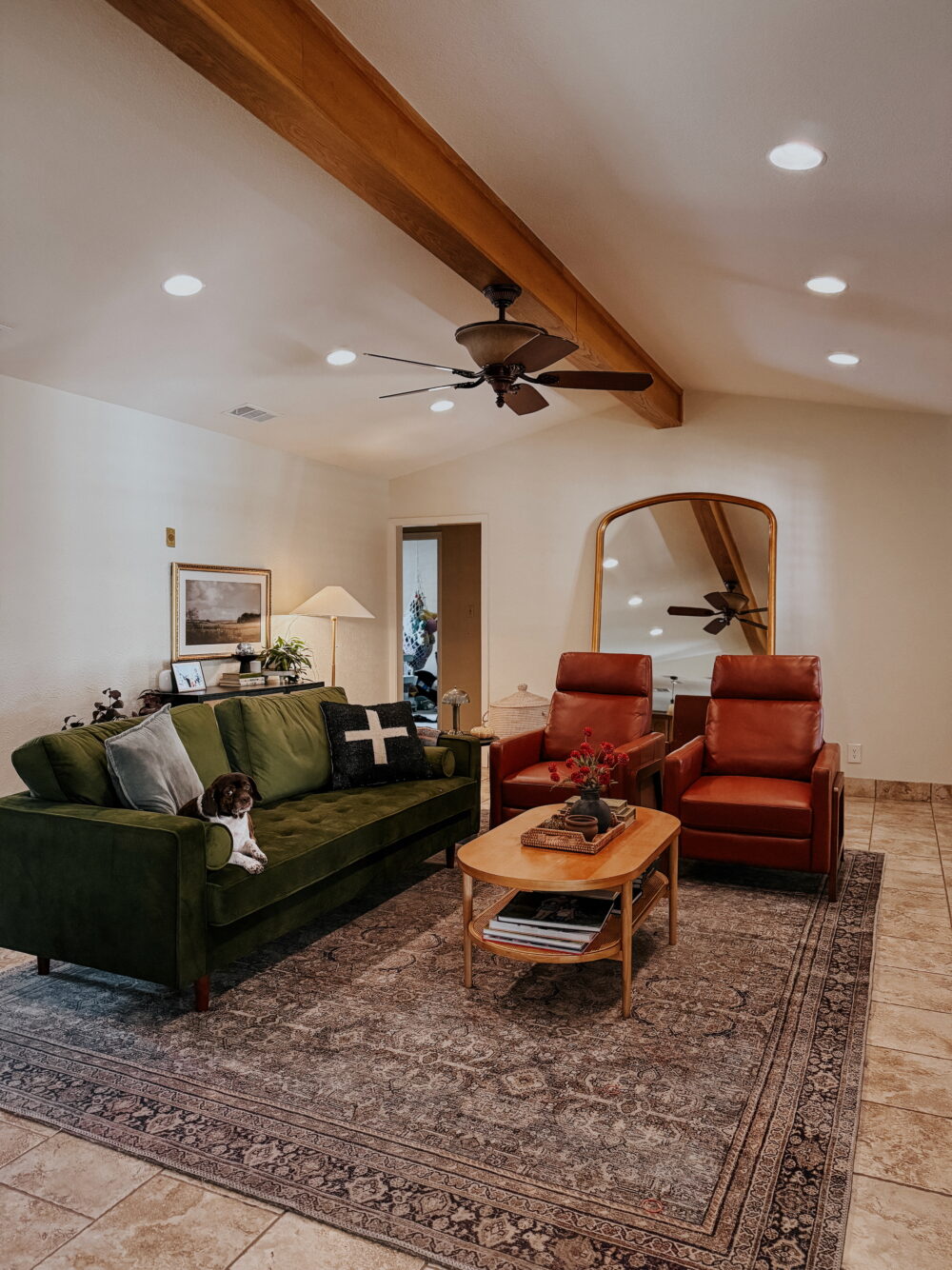 living room with green sofa and two brown recliners