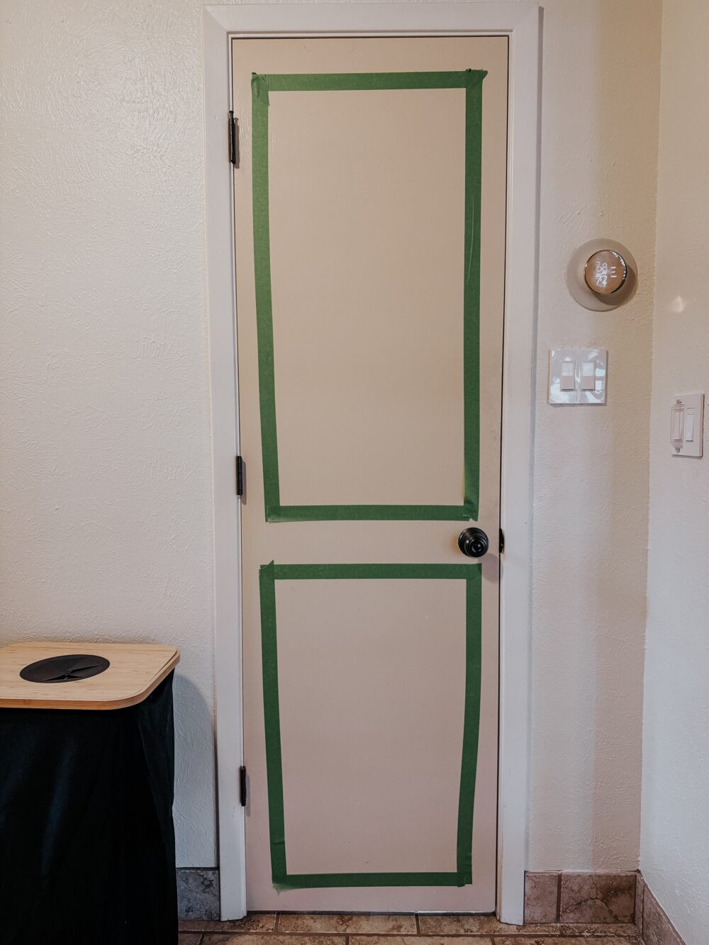 a pantry door with tape on the door to plan panels 