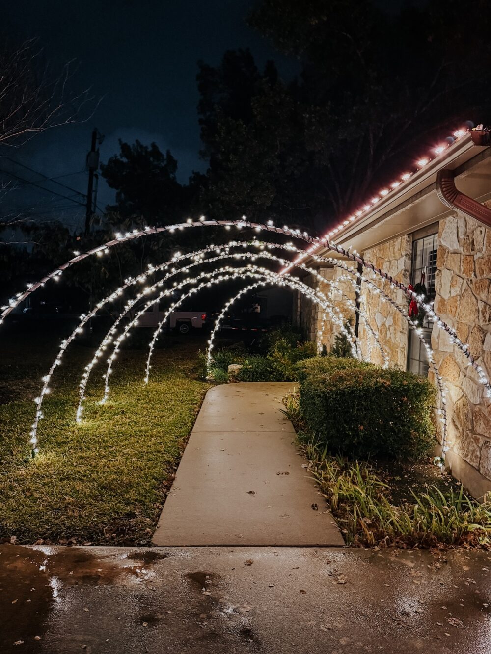 front entrance with light arches for Christmas