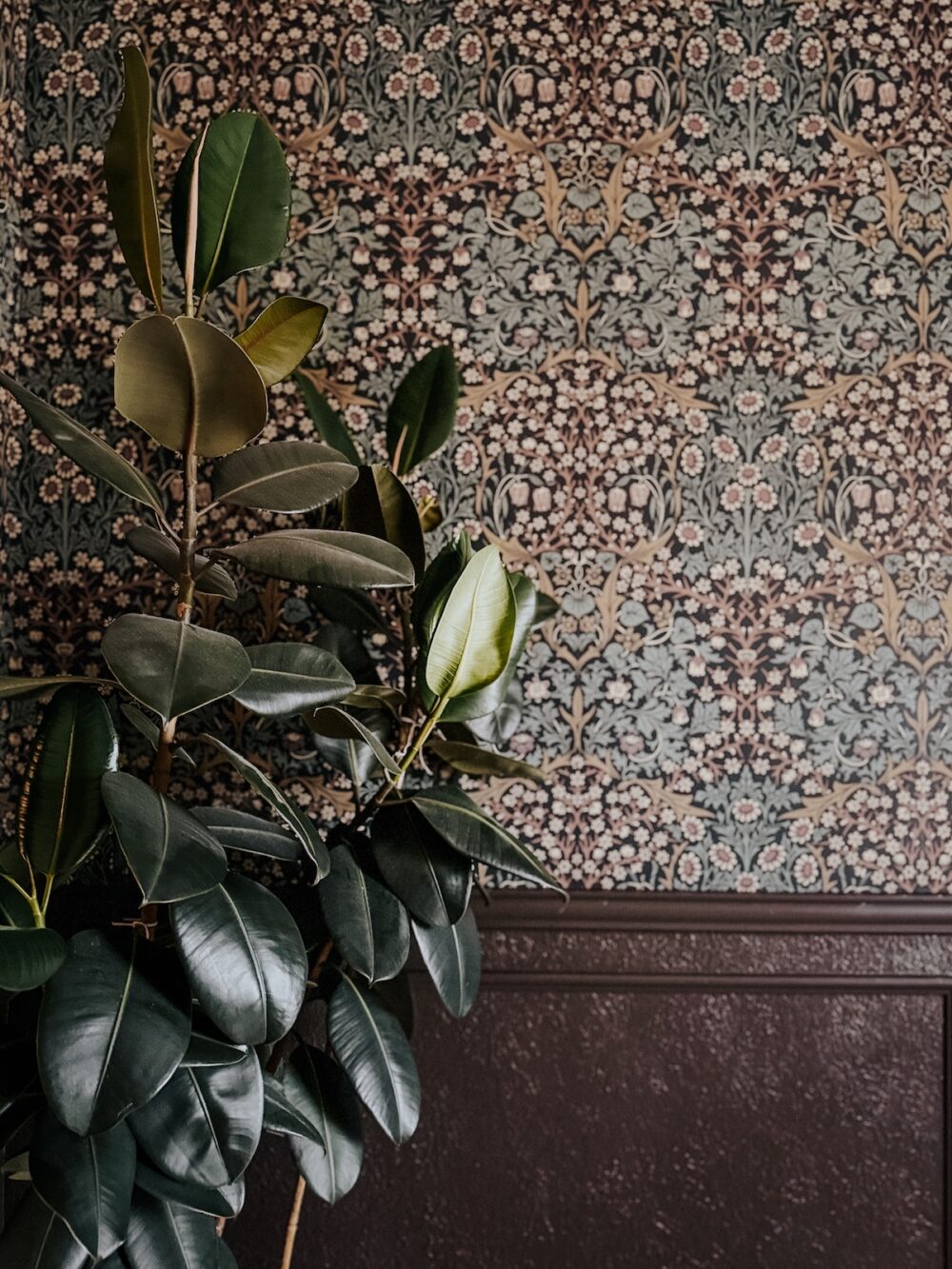 close up of dining room with wallpaper and box molding