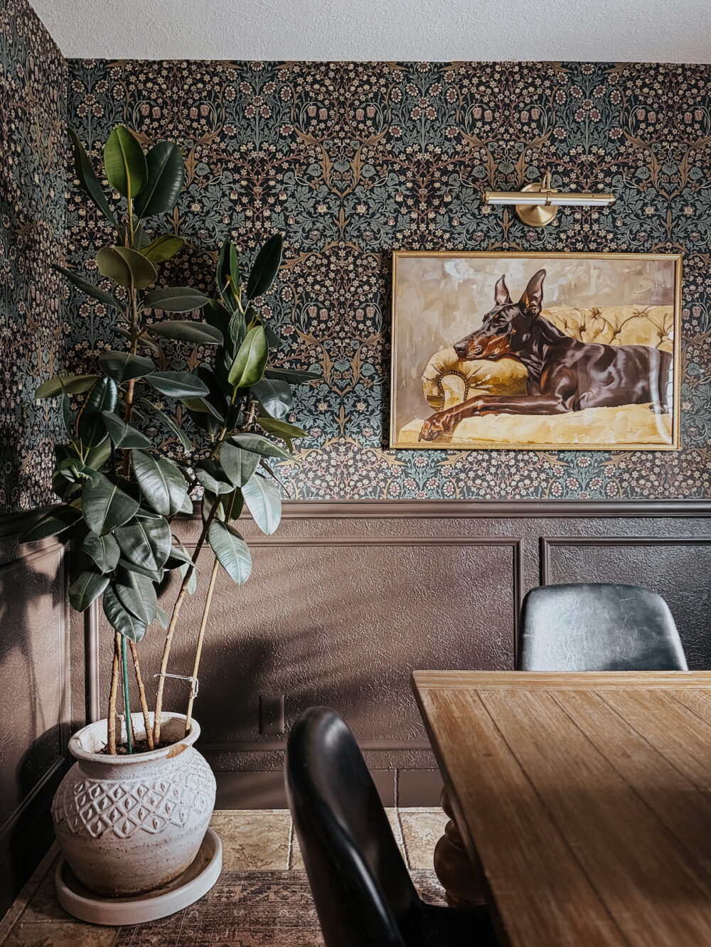 close up of dining room wallpaper and quirky dining room art