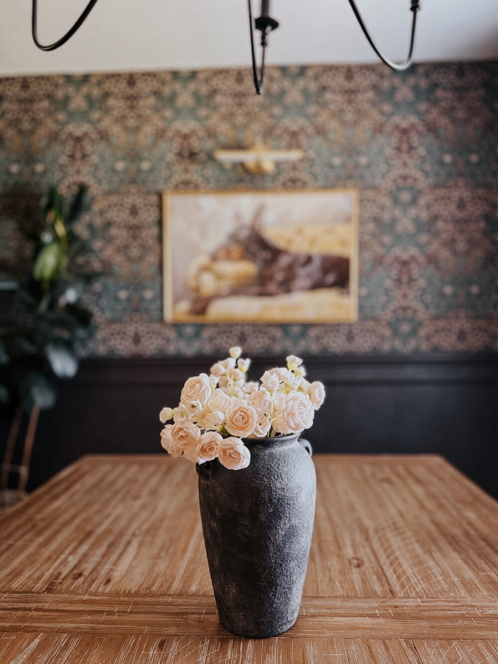 black vase on a wood table
