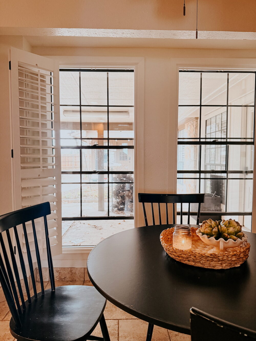 kitchen nook with a black table and chairs