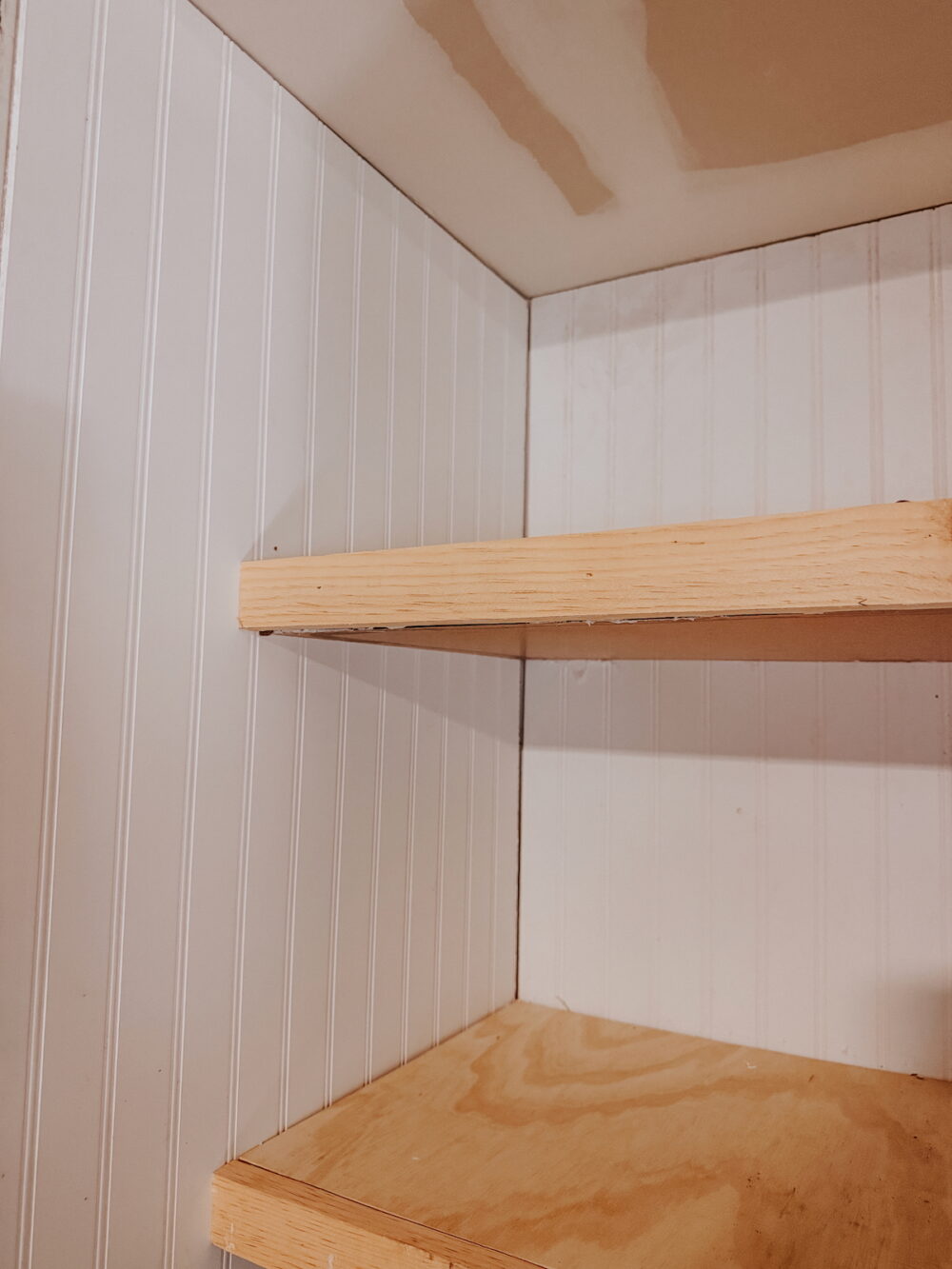 Close up of DIY floating shelves inside a nook