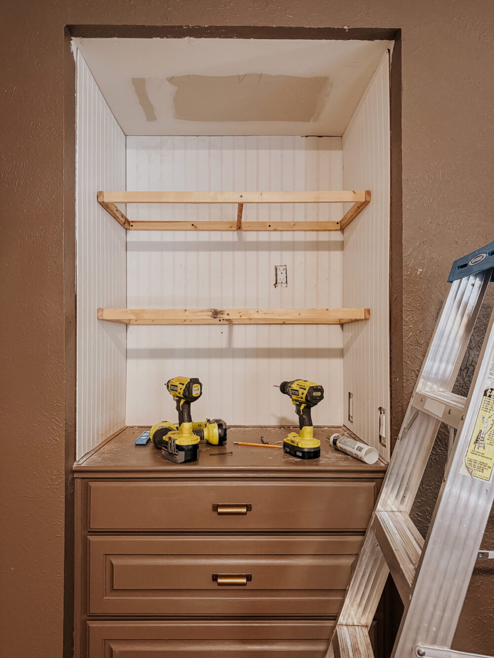 internal supports for DIY floating shelves installed in a 3-sided nook