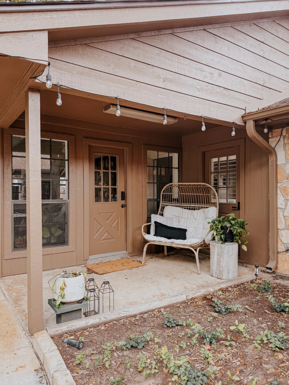small patio with brown siding and trim