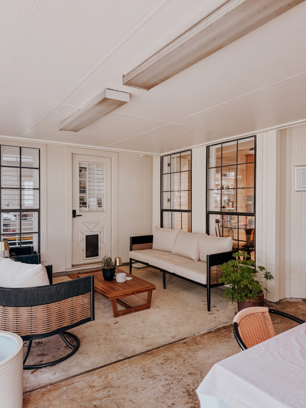 back patio with sofa and coffee table, and swivel chairs