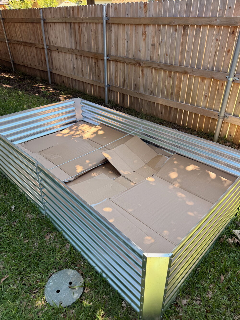 layer of cardboard in a raised garden bed