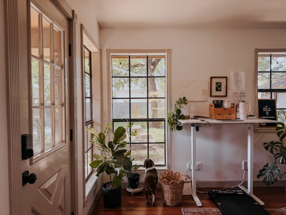 sun-filled office with white walls and greige trim on the windows and doors