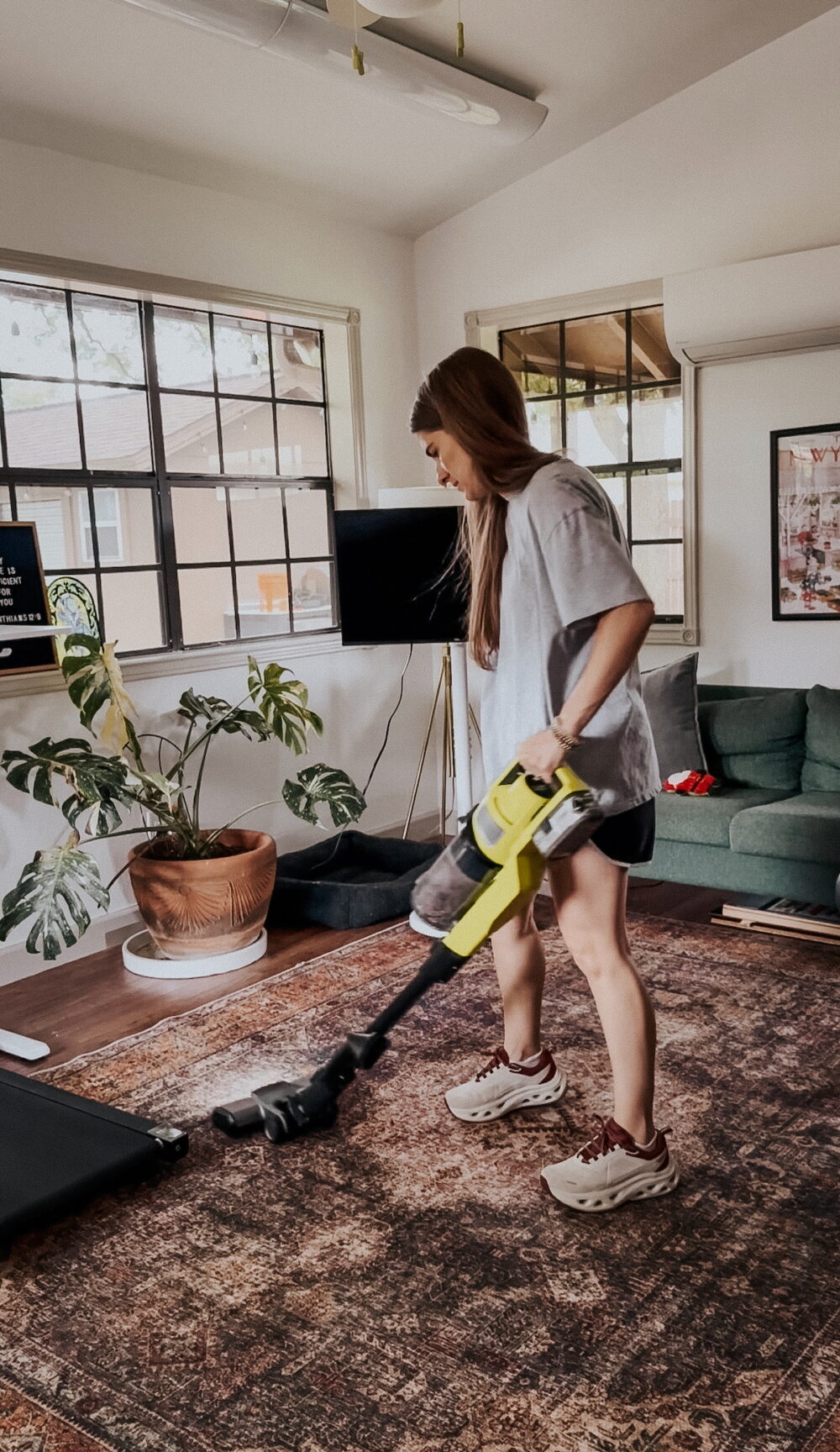 woman vacuuming an office rug