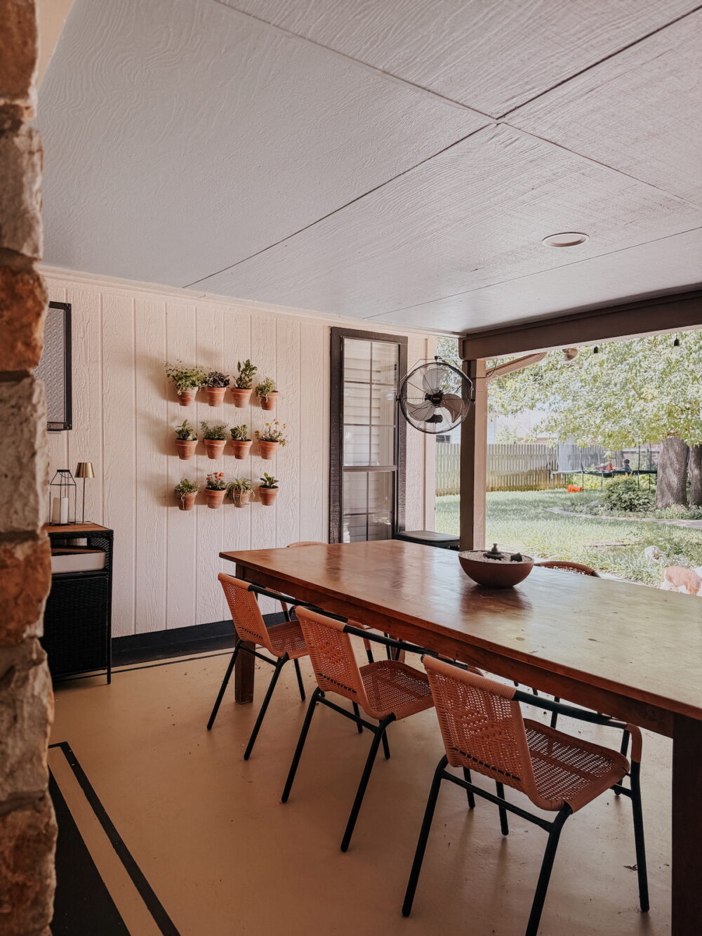 covered patio with a simple plant wall