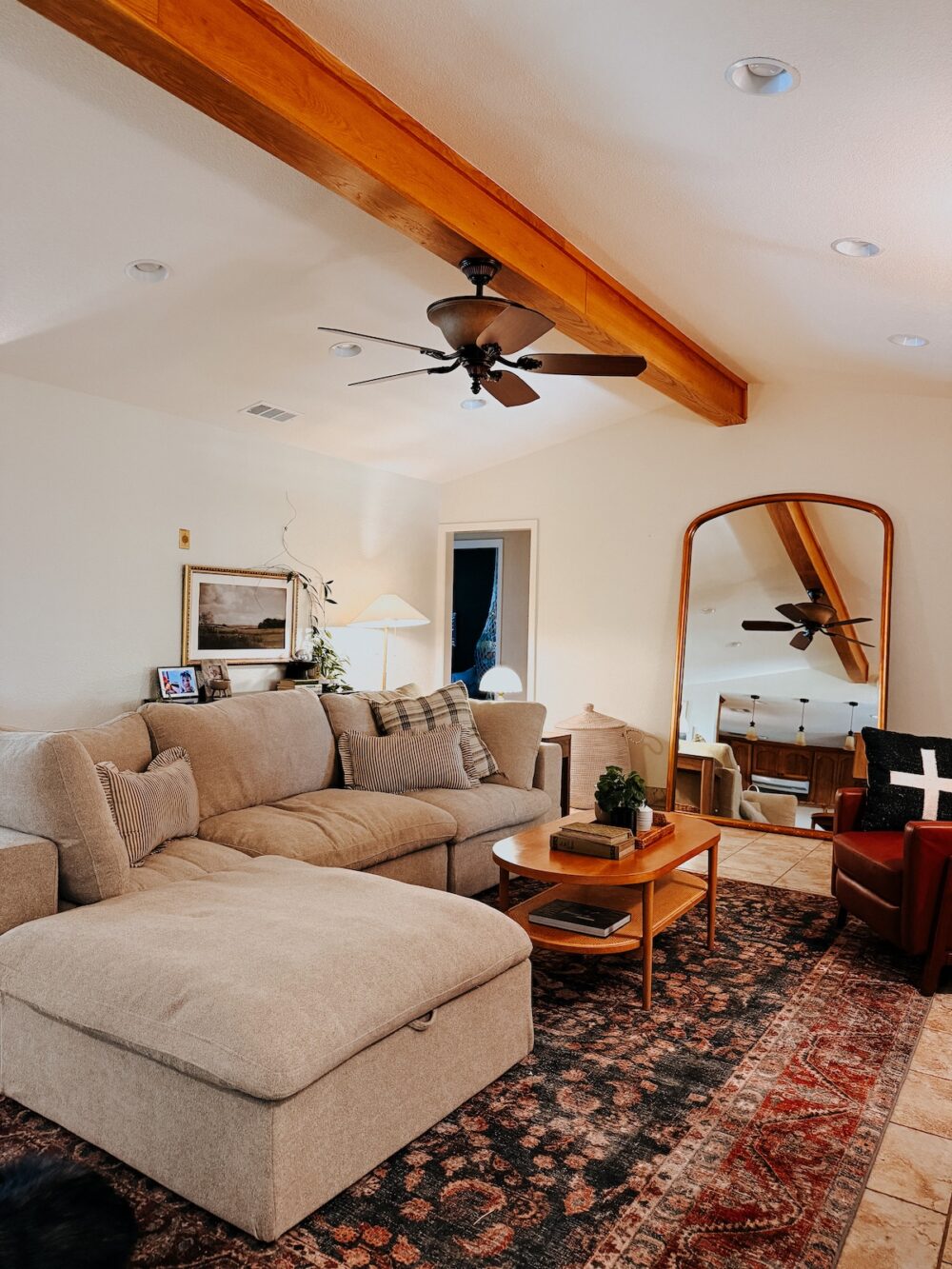 living room with large chaise and a recliner