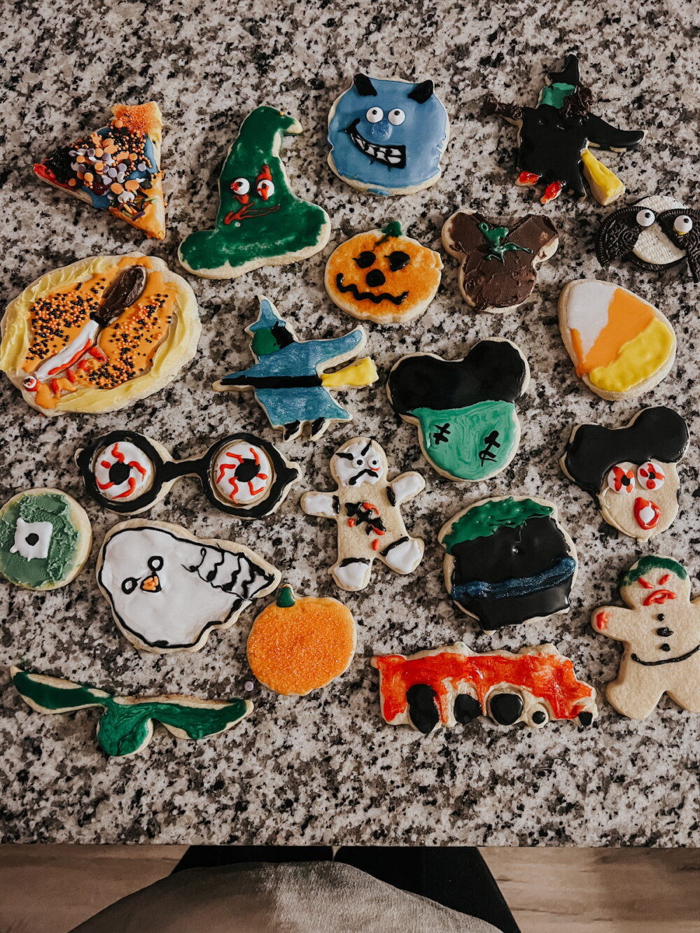 overhead image of a collection of decorated sugar cookies for Halloween