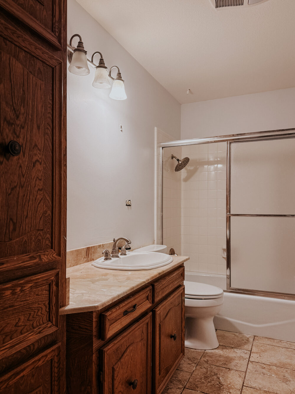 small bathroom after wallpaper removal with primed walls