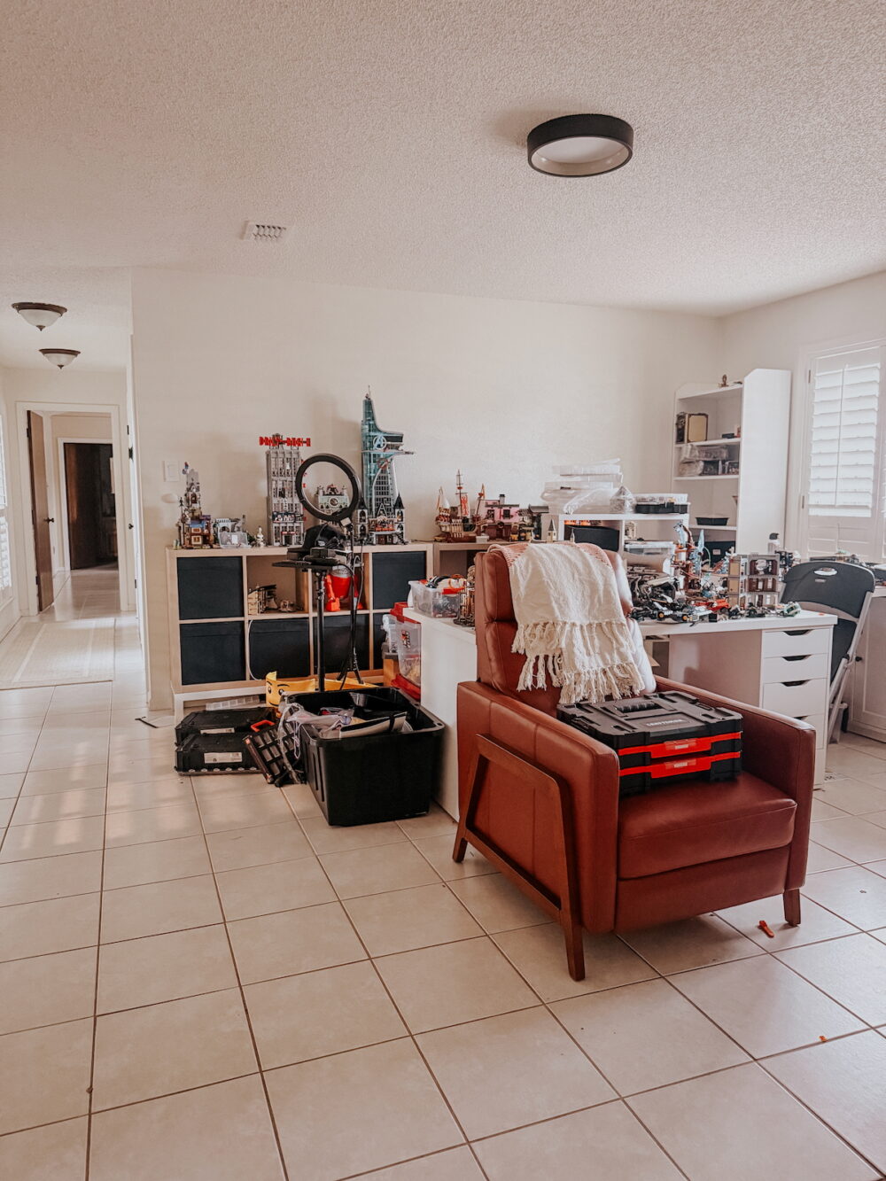 large room with boxes of legos and shelves