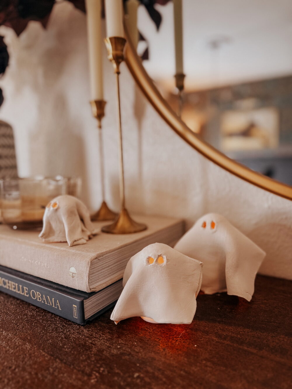 air dry clay ghosts covering a tea light candle