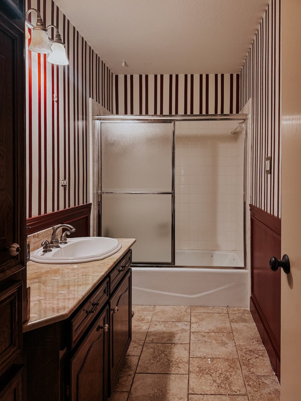 bathroom with striped red walls