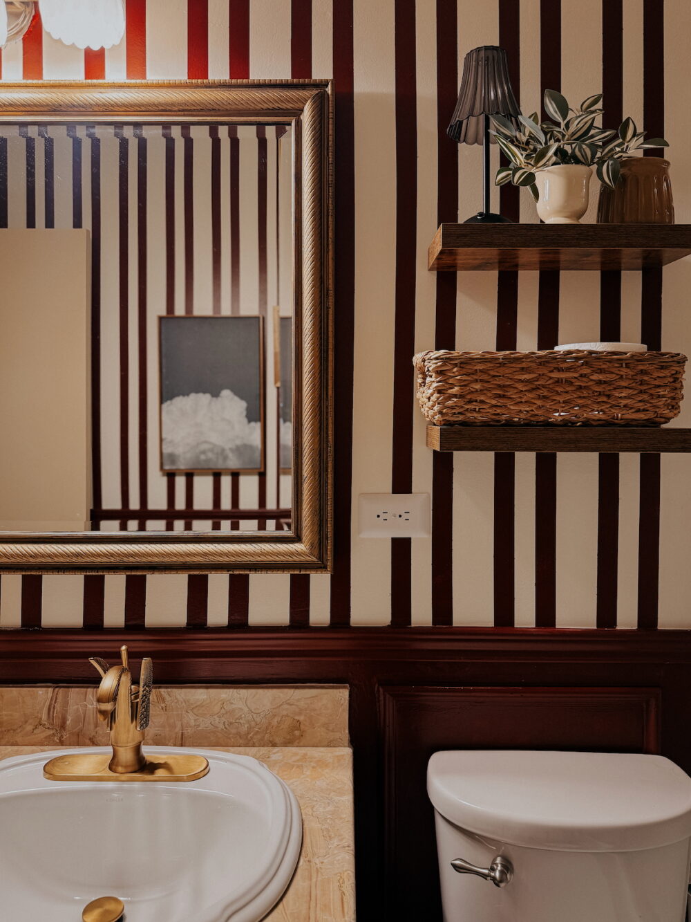 close up of floating shelves and mirror in a small bathroom makeover
