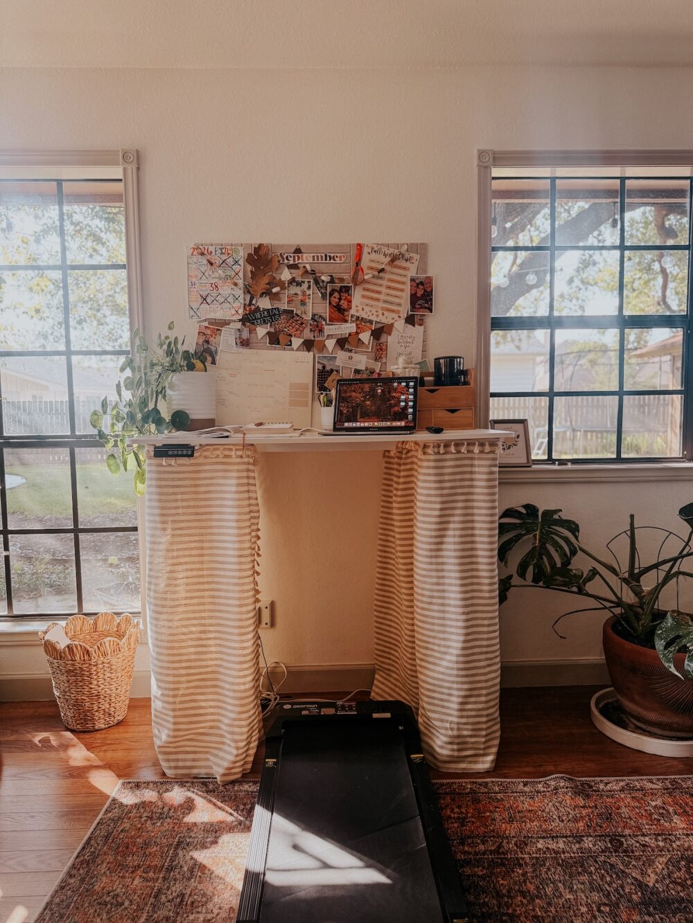 home office with a standing desk with a striped table skirt