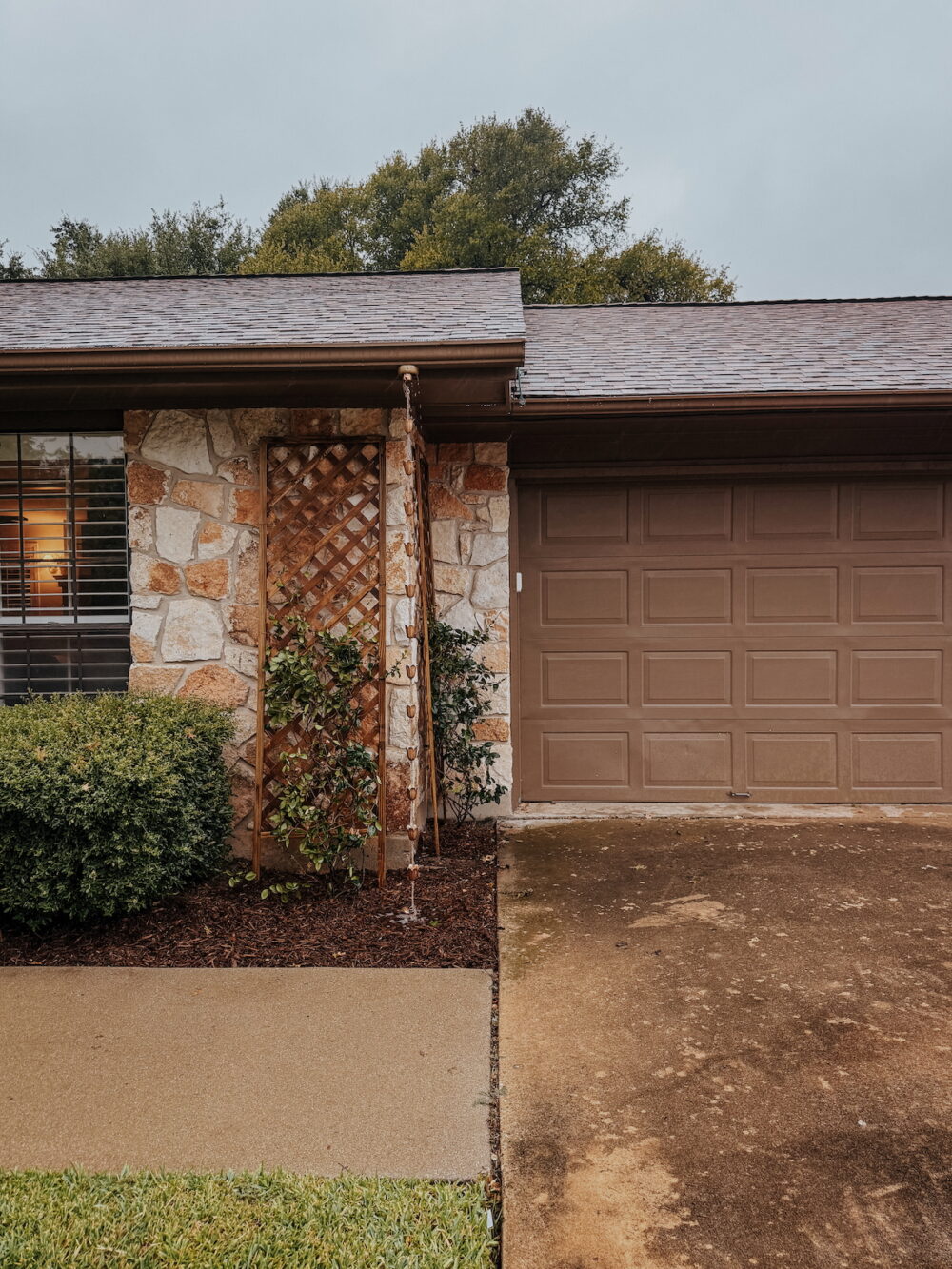 Traditional stone house with a rain chain